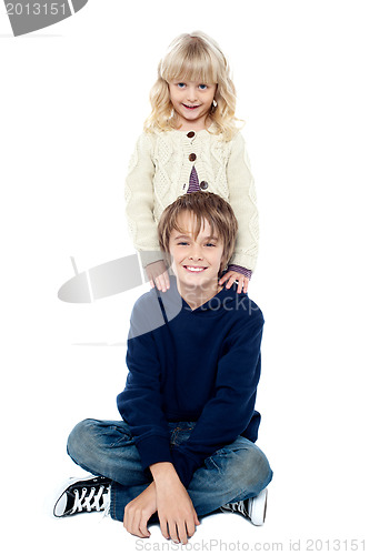 Image of Affectionate brother and sister posing for a portrait
