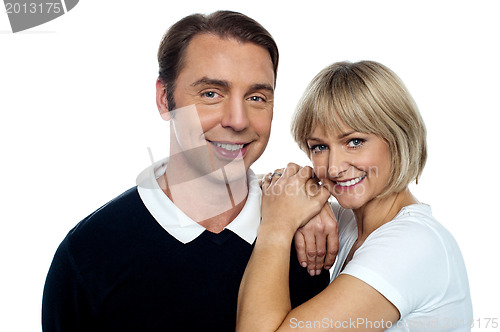 Image of Adorable wife cuddling up her handsome husband