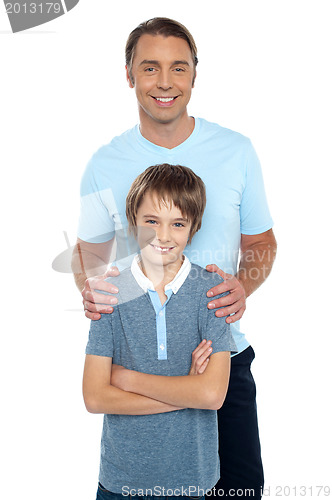 Image of Middle aged father posing with his smart son