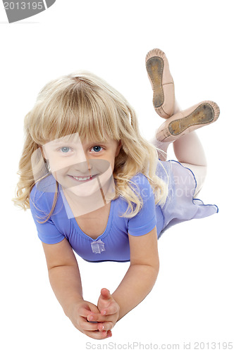 Image of Sweet little girl posing relaxed on the floor