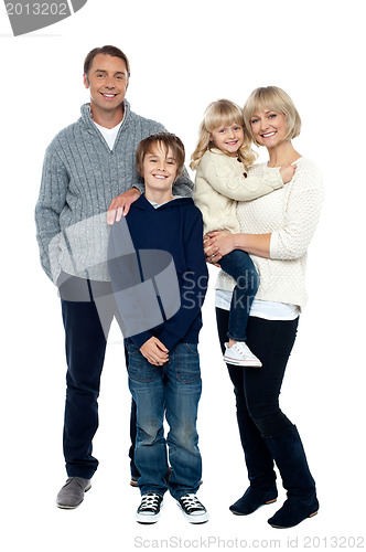 Image of Happy family posing in trendy winter wear outfits