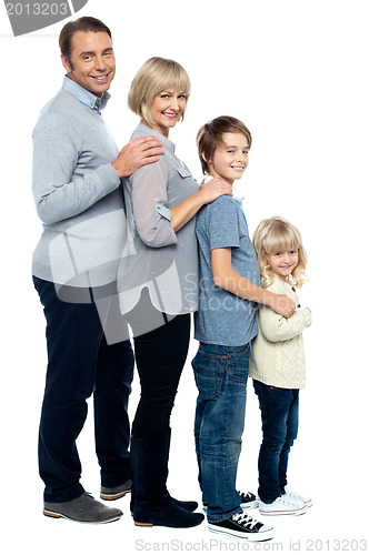 Image of Full length family portrait of four members