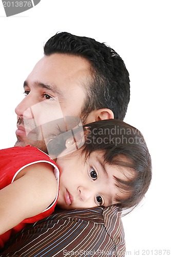 Image of beautiful little girl hugging embracing her father.  Focus in th