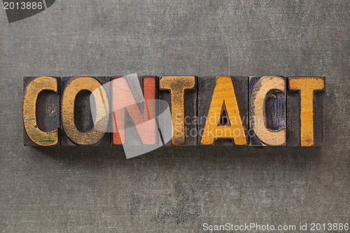 Image of contact word in wood type