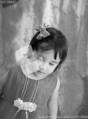 Image of Black and white portrait of tired little girl with sad eyes. 