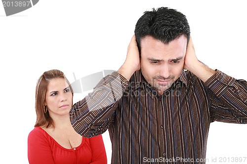 Image of Couple having an argument. Focus on man