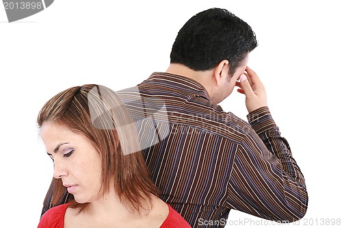 Image of Young couple standing back to back having relationship difficult