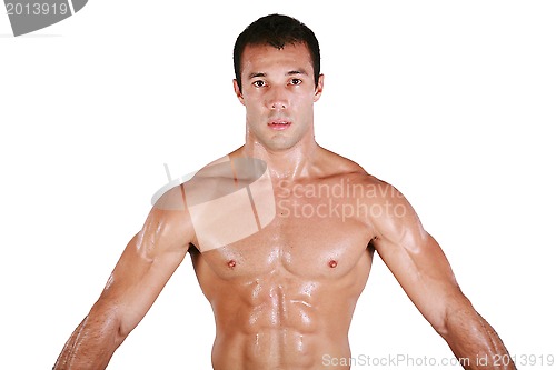 Image of Muscular shirtless man after work out, looking at camera