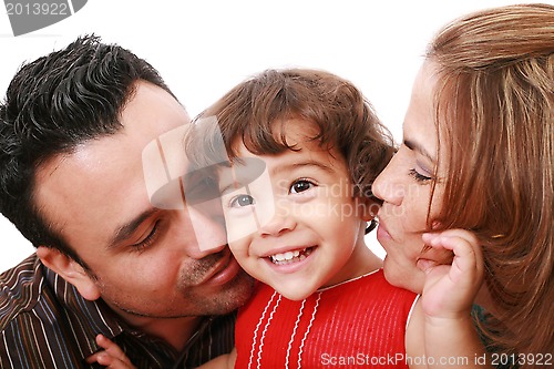 Image of Parents giving their daughter a kiss. 