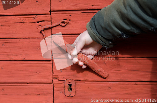 Image of Old wooden doorhandle