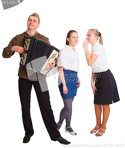 Image of A guy with an accordion and two girls