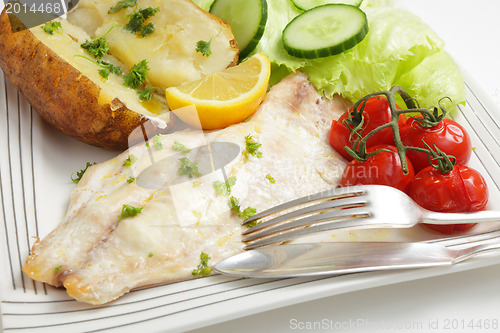 Image of Baked fish fillet, tomatoes, potato and salad