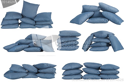 Image of seven stacks of blue denim pillows