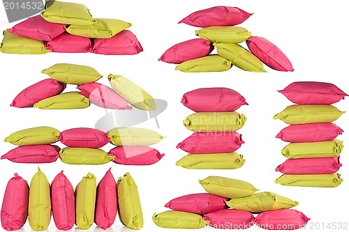 Image of bright pink and green pillows isolated on white
