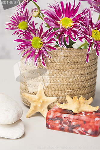 Image of Spa setting with natural soaps and flower