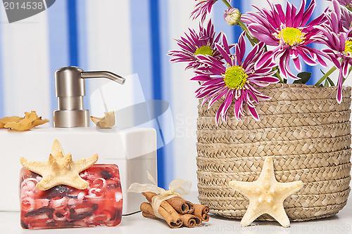 Image of Spa setting with natural soaps and flower