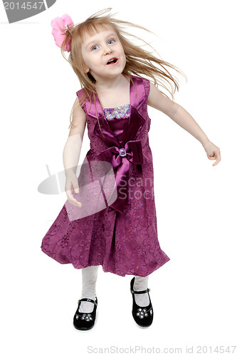Image of Full length of cheerful young girl jumping in joy over white bac