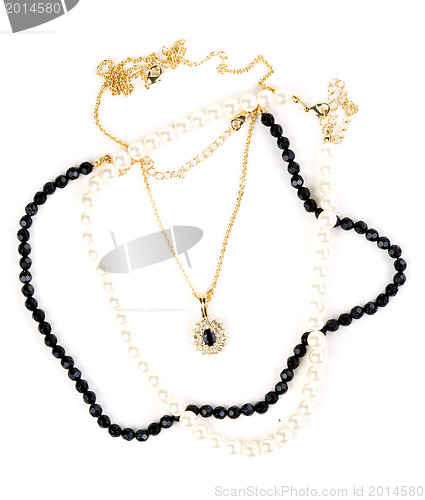 Image of beads and chain with a pendant
