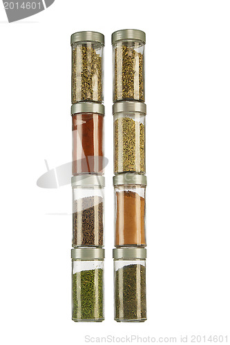 Image of colorful powder spices in glass bottle