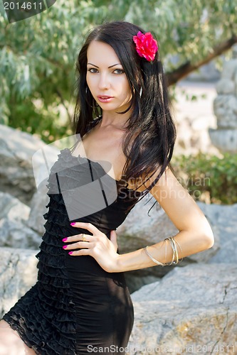 Image of young woman in black dress 