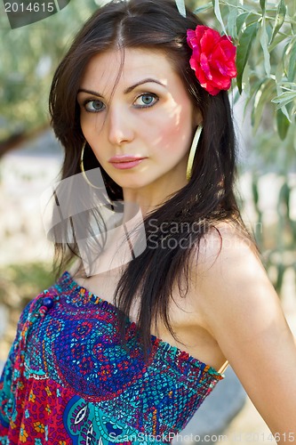 Image of pretty young brunette outdoors