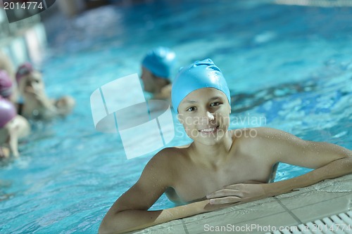 Image of happy children group  at swimming pool