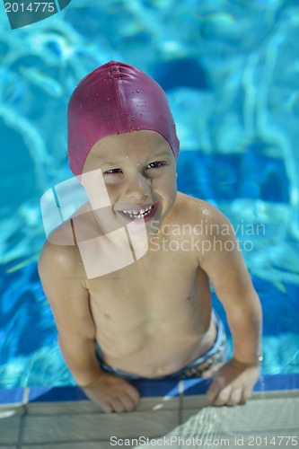 Image of happy child on swimming pool