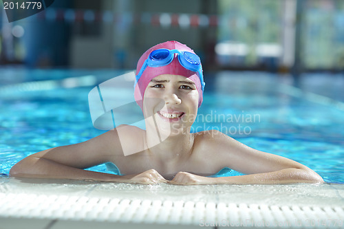 Image of happy child on swimming pool