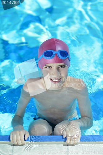 Image of happy child on swimming pool