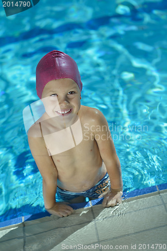 Image of happy child on swimming pool