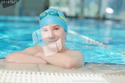 Image of happy child on swimming pool