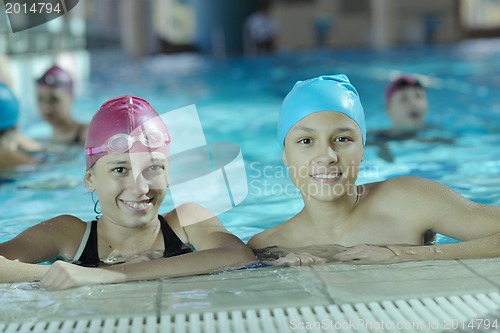 Image of happy children group  at swimming pool