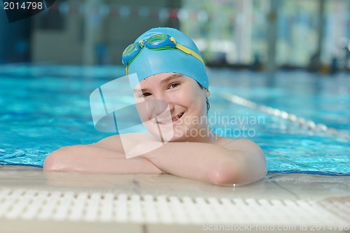 Image of happy child on swimming pool