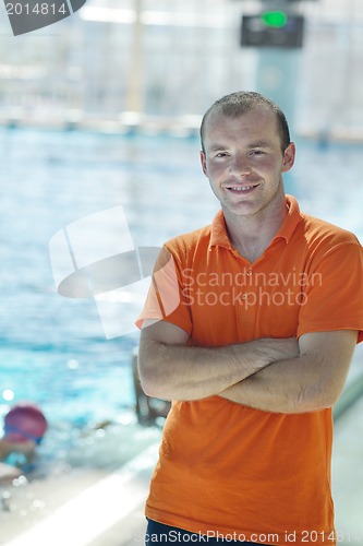 Image of happy child group  at swimming pool