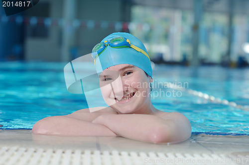 Image of happy child on swimming pool