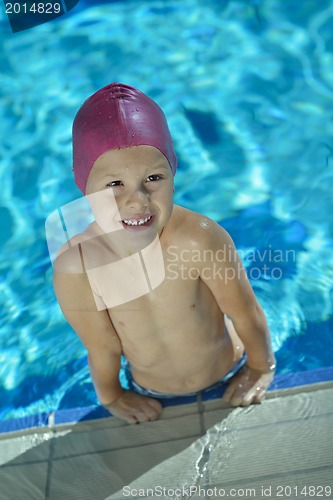 Image of happy child on swimming pool
