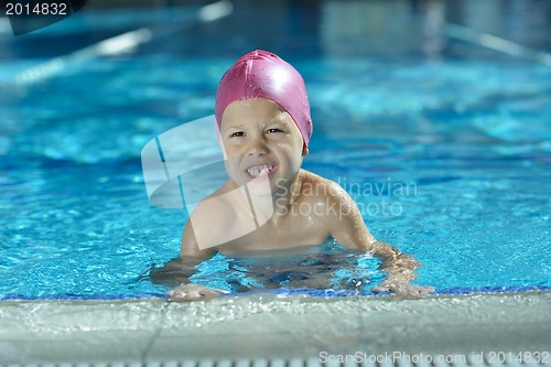 Image of happy child on swimming pool