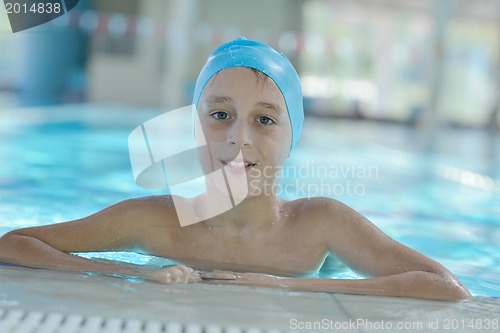 Image of happy child on swimming pool