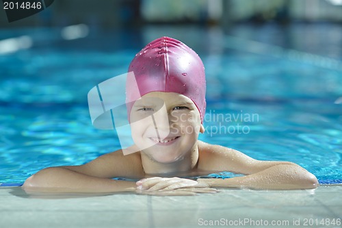 Image of happy child on swimming pool