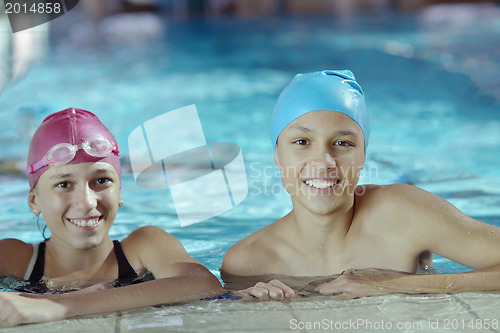 Image of happy children group  at swimming pool