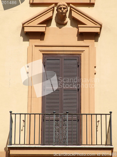 Image of Orange wall and a decorative balcony