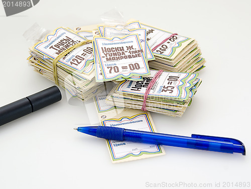 Image of A heap of price-tags, pen and marker