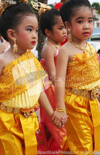 Image of Young Thai girls in traditional dress participate in a parade