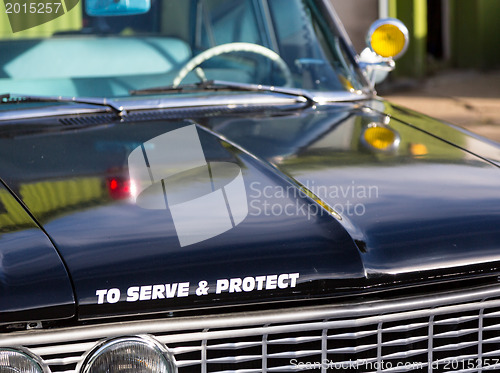 Image of Vintage police car detail on hood 