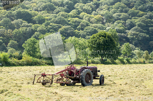 Image of Antique tractor and threshing machine