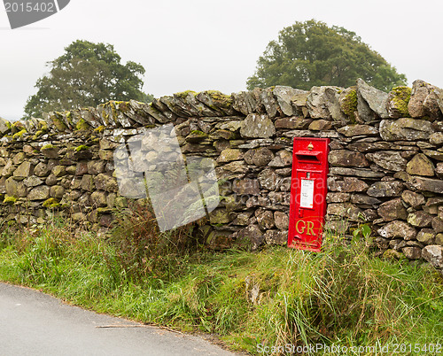 Image of Old King George red post box in stone wall