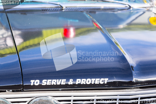 Image of Vintage police car detail on hood 