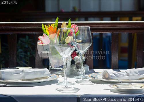 Image of Table setting exterior restaurant in sunshine