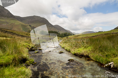 Image of Rocky stream leads towards Buttermere