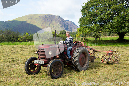 Image of Antique David Brown tractor and threshing machine